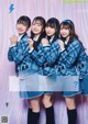 A group of young women in school uniforms posing for a magazine.