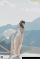 A woman standing on top of a wooden platform.